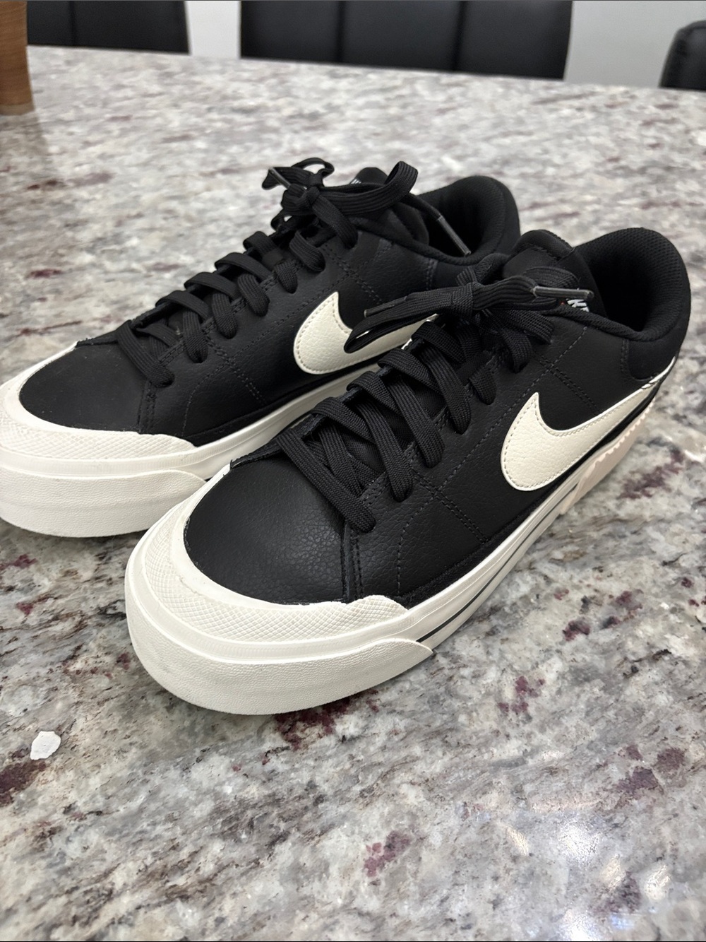 Nike Black Sneakers with Cream Swoosh and Sole